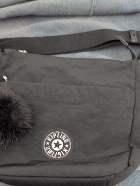 Kipling Black Crossbody with Pom Pom Charm Like New
